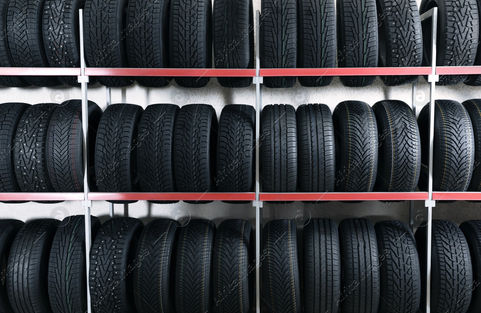 Photo of Car tires on rack in auto store