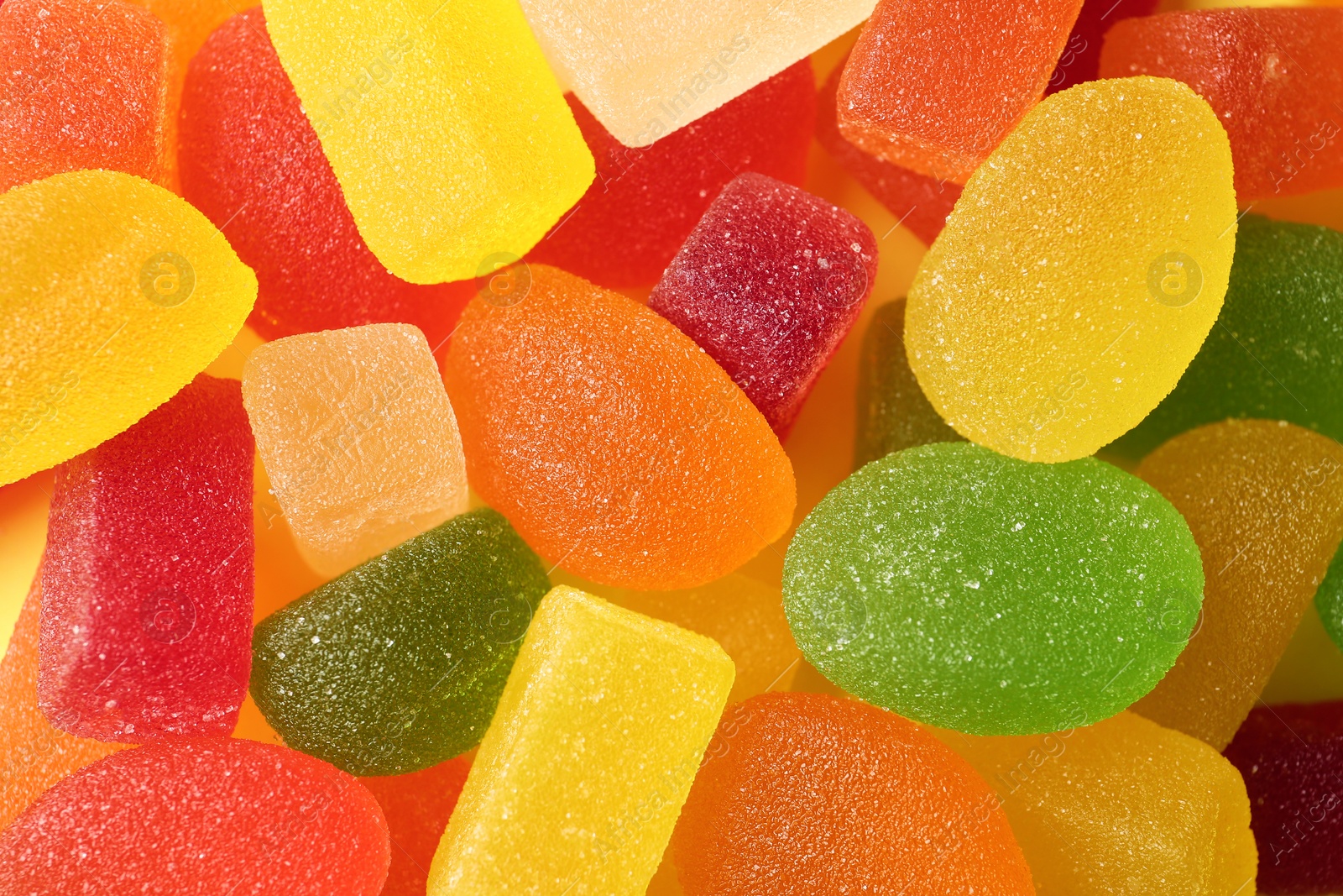 Photo of Tasty colorful jelly candies as background, top view