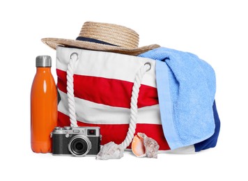 Photo of Stylish bag, camera and other beach accessories isolated on white