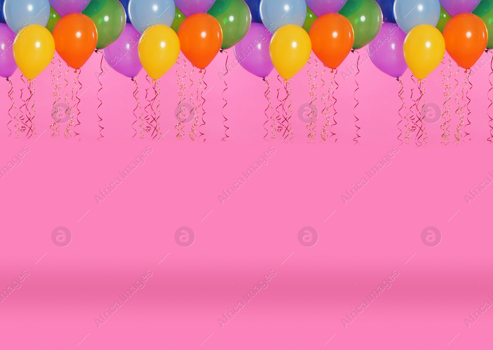 Image of Many color balloons on pink background. Space for text