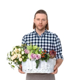 Photo of Male florist holding basket with flowers on white background