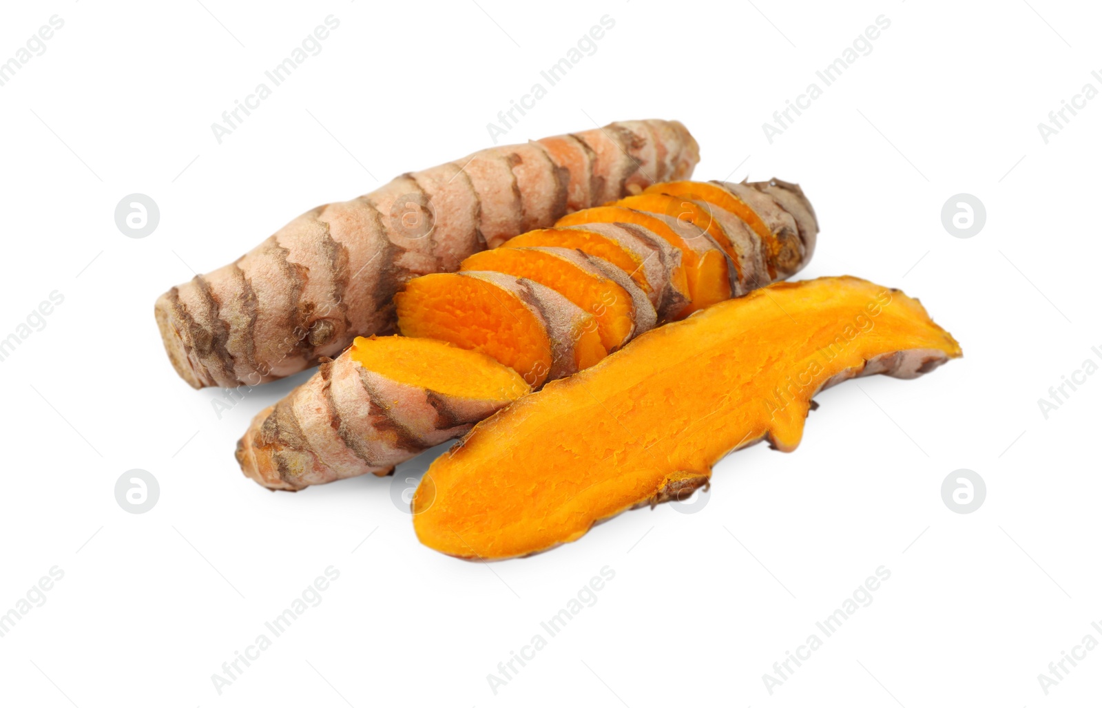 Photo of Whole and cut turmeric roots isolated on white