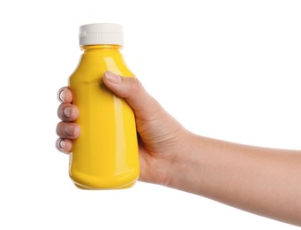 Photo of Woman with bottle of mustard on white background, closeup