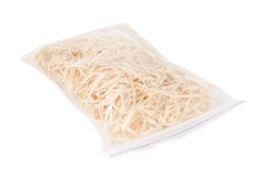 Photo of Wood shavings in zip bag isolated on white