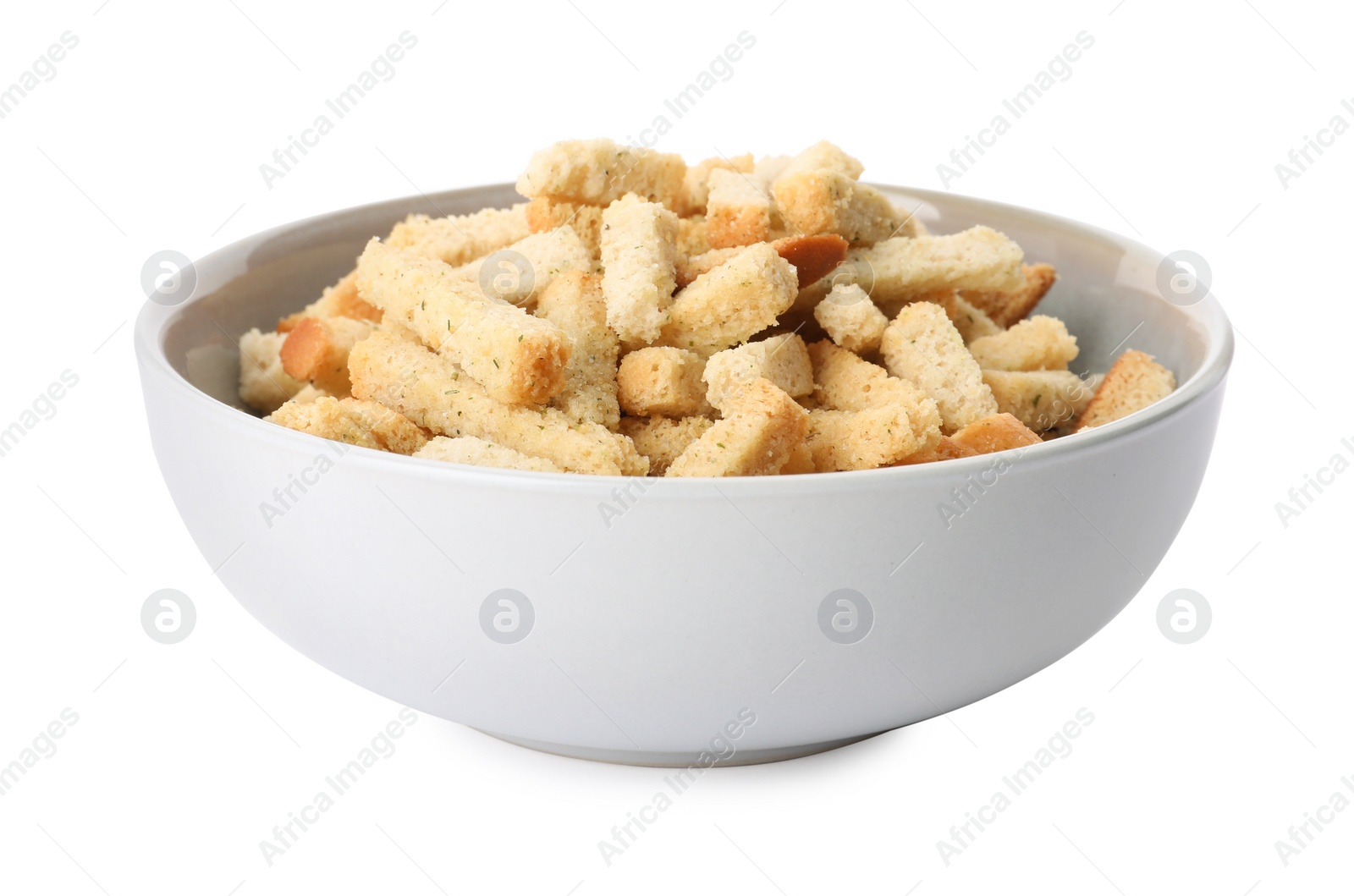 Photo of Crispy rusks with seasoning in bowl isolated on white