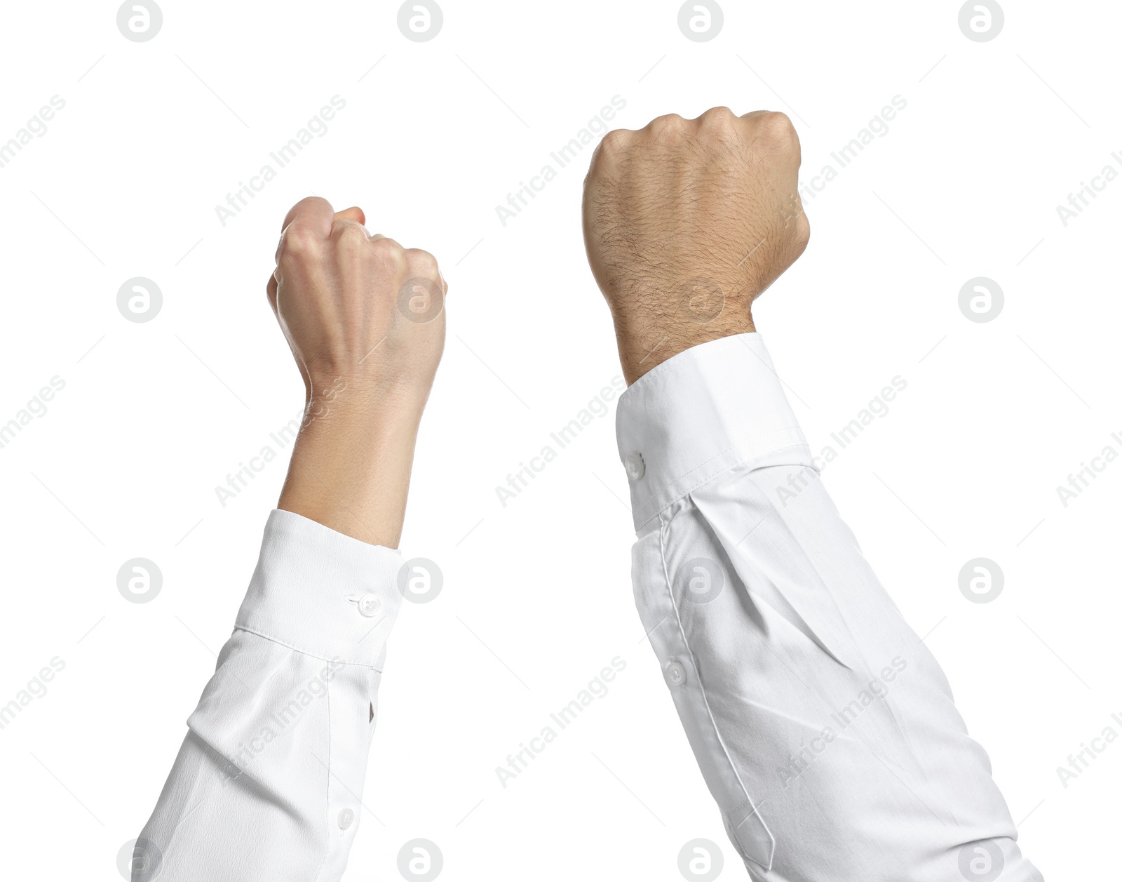 Photo of Strike. Man and woman showing clenched fists on white background, closeup