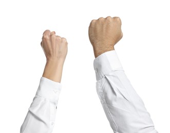 Photo of Strike. Man and woman showing clenched fists on white background, closeup