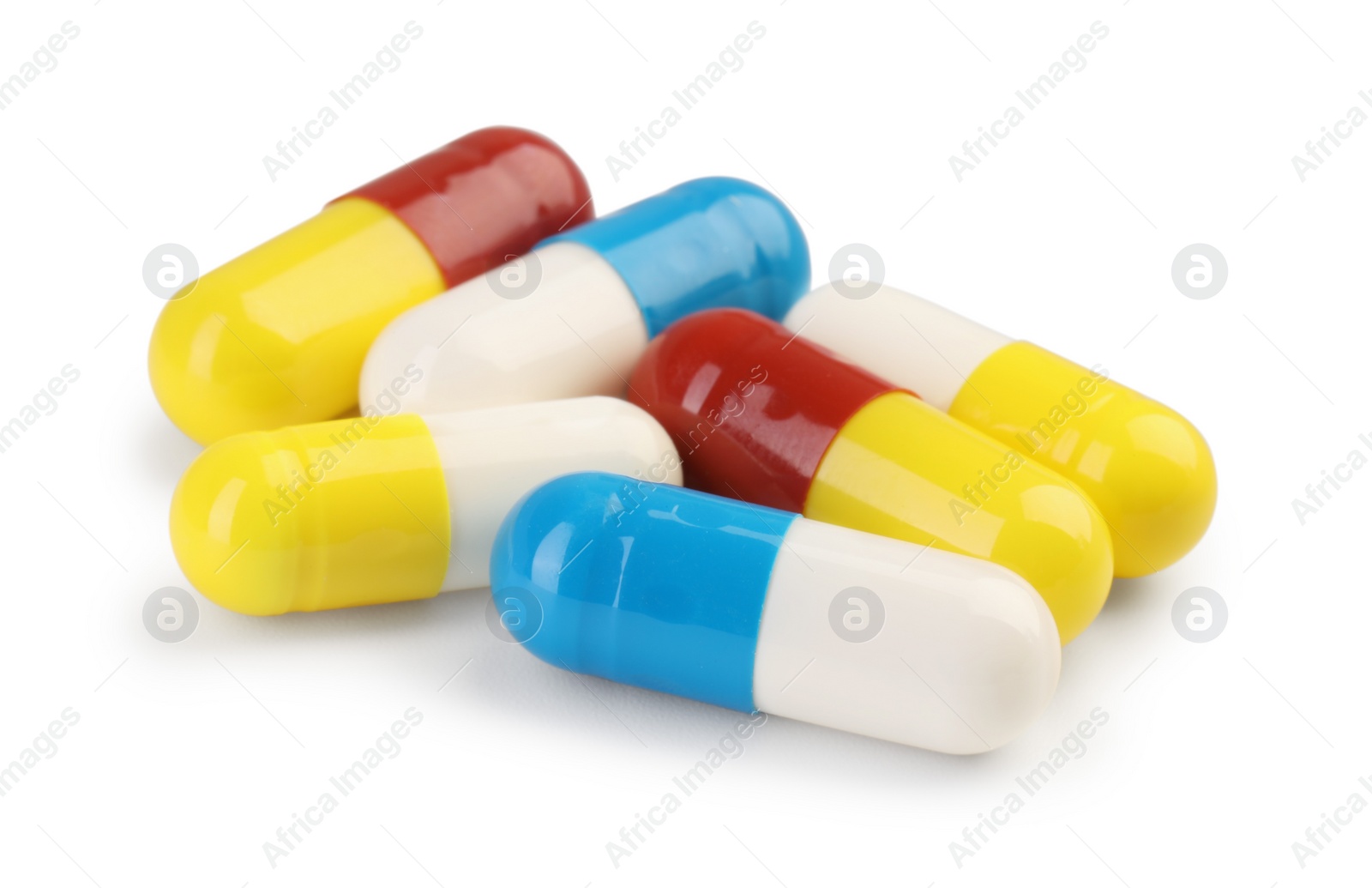 Photo of Many antibiotic pills isolated on white. Medicinal treatment