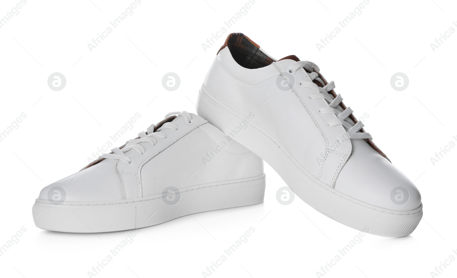 Photo of Pair of stylish sports shoes on white background