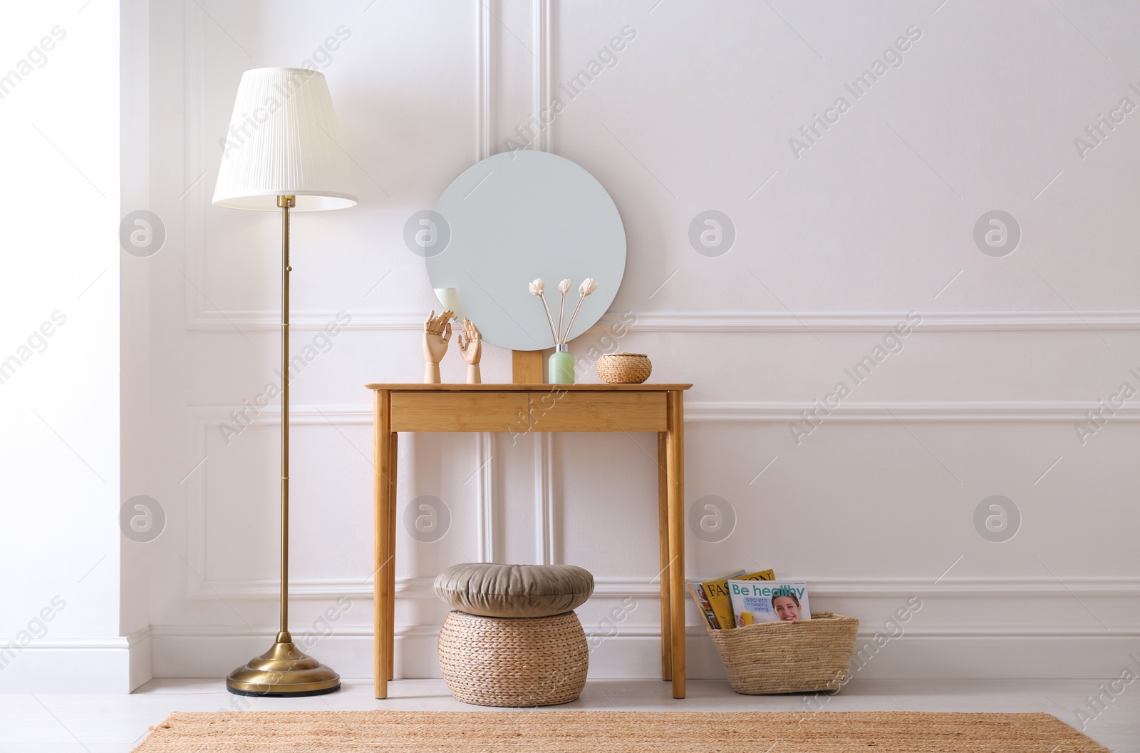 Photo of Elegant room interior with console table and floor lamp