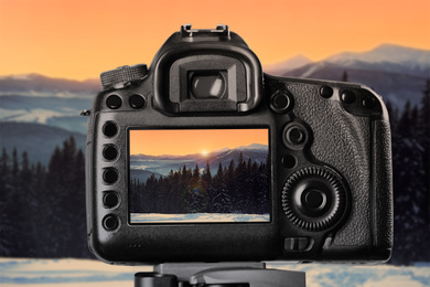 Image of Recording beautiful view of mountain landscape on professional video camera