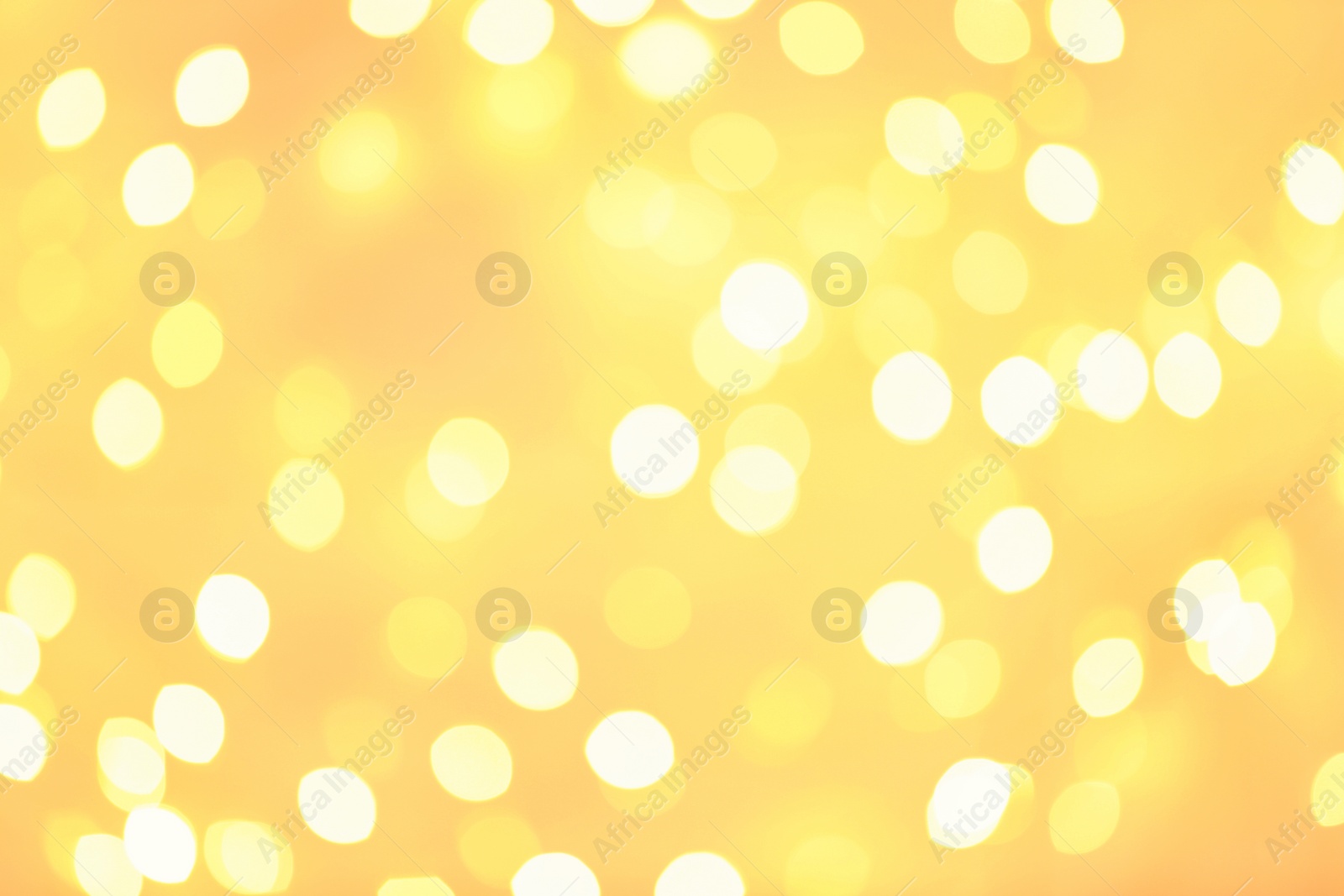 Photo of Beautiful golden lights as background. Bokeh effect