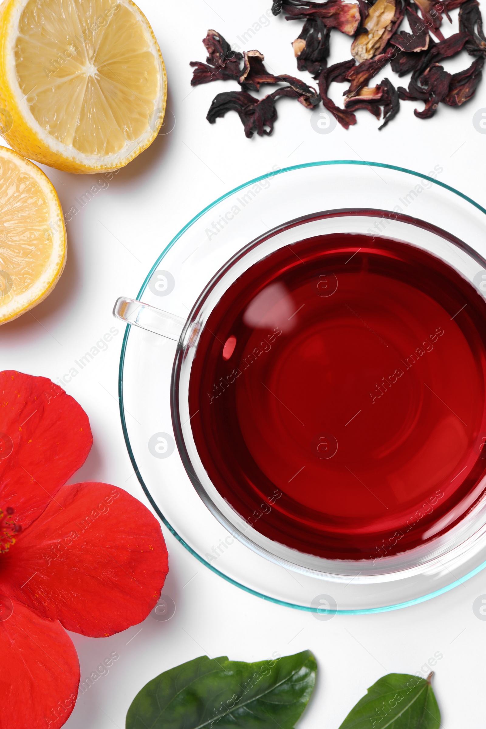 Photo of Flat lay composition with delicious hibiscus tea on white background