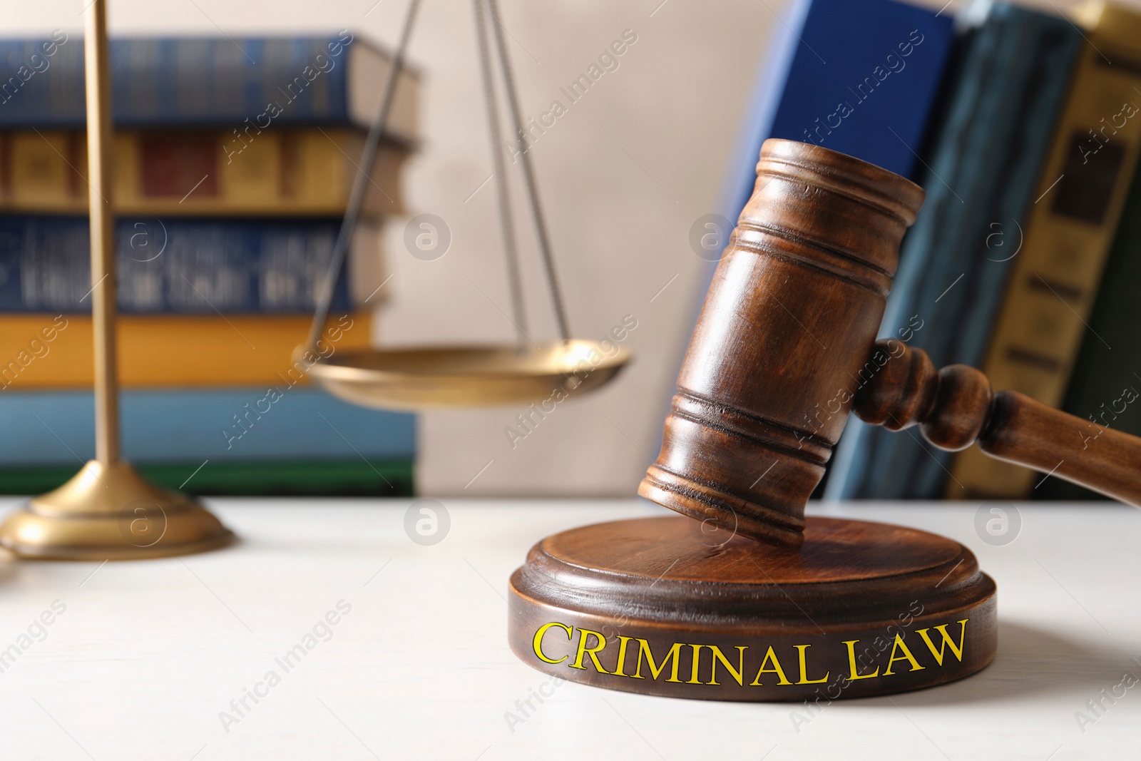 Image of Wooden gavel, scales of justice and books on table. Criminal law concept