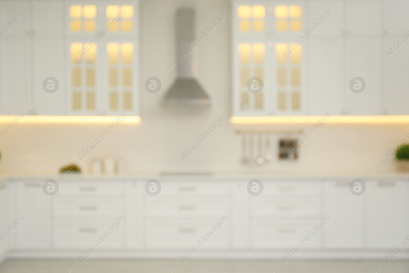 Photo of Blurred view of modern kitchen interior with stylish furniture