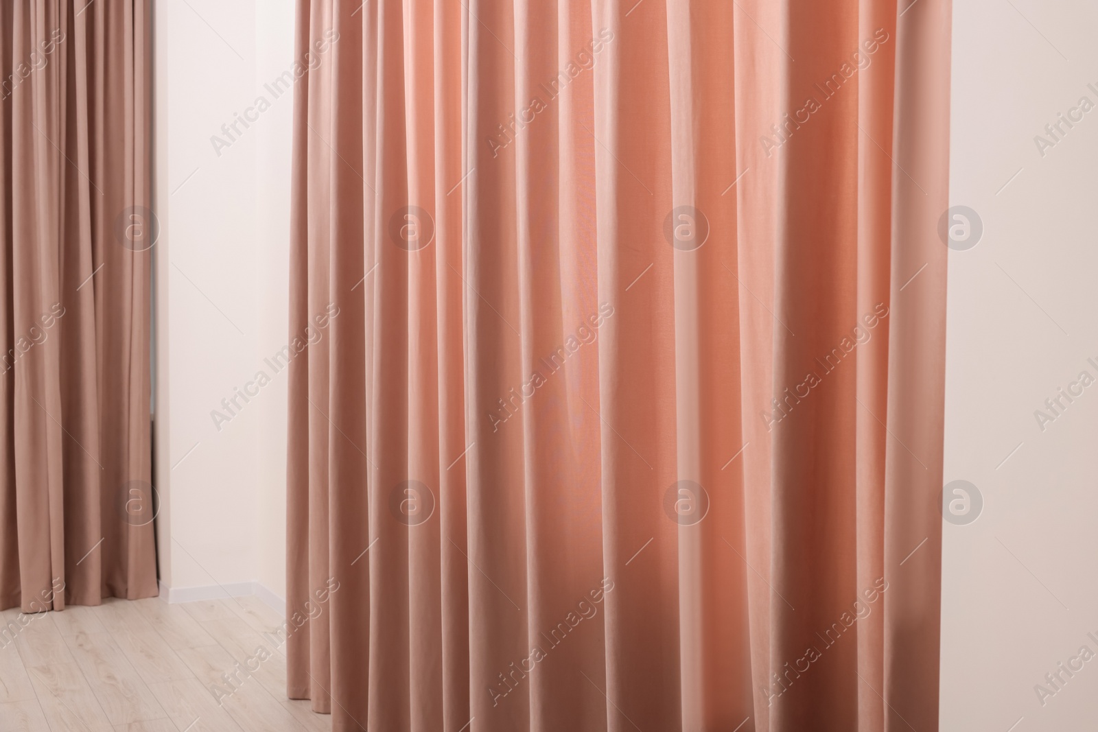 Photo of Elegant window curtains in room. Interior design