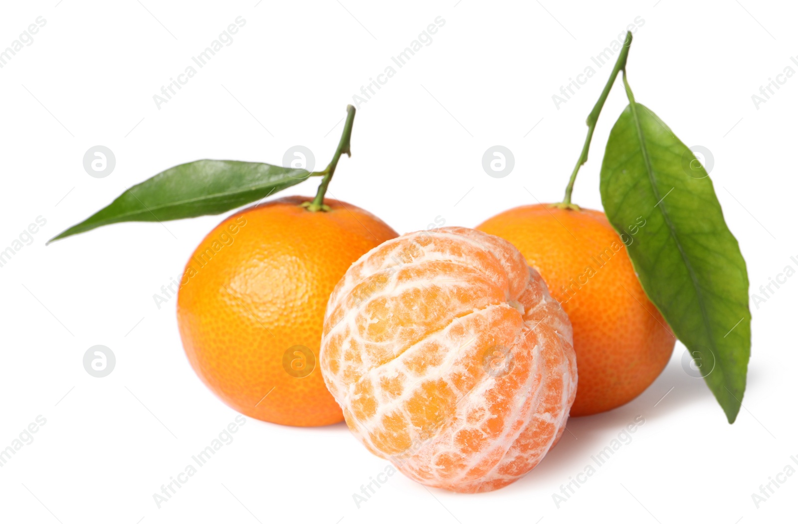 Photo of Fresh ripe juicy tangerines with green leaves isolated on white