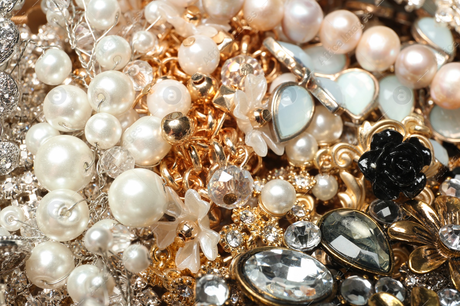 Photo of Different stylish jewelry as background, closeup view