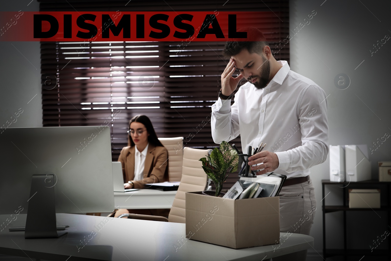 Image of Dismissed man packing personal stuff into box in office