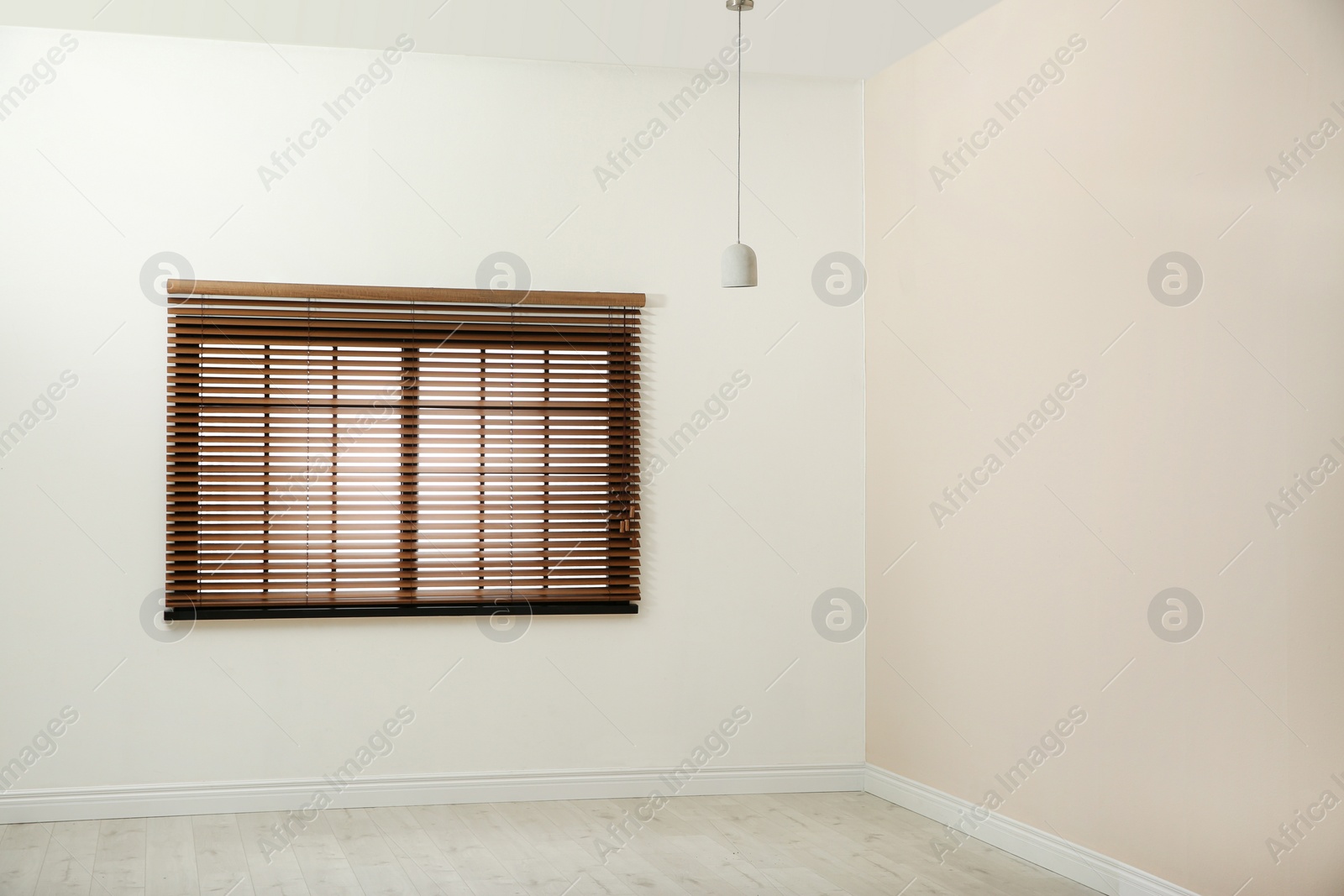 Photo of Window with brown blinds in empty room