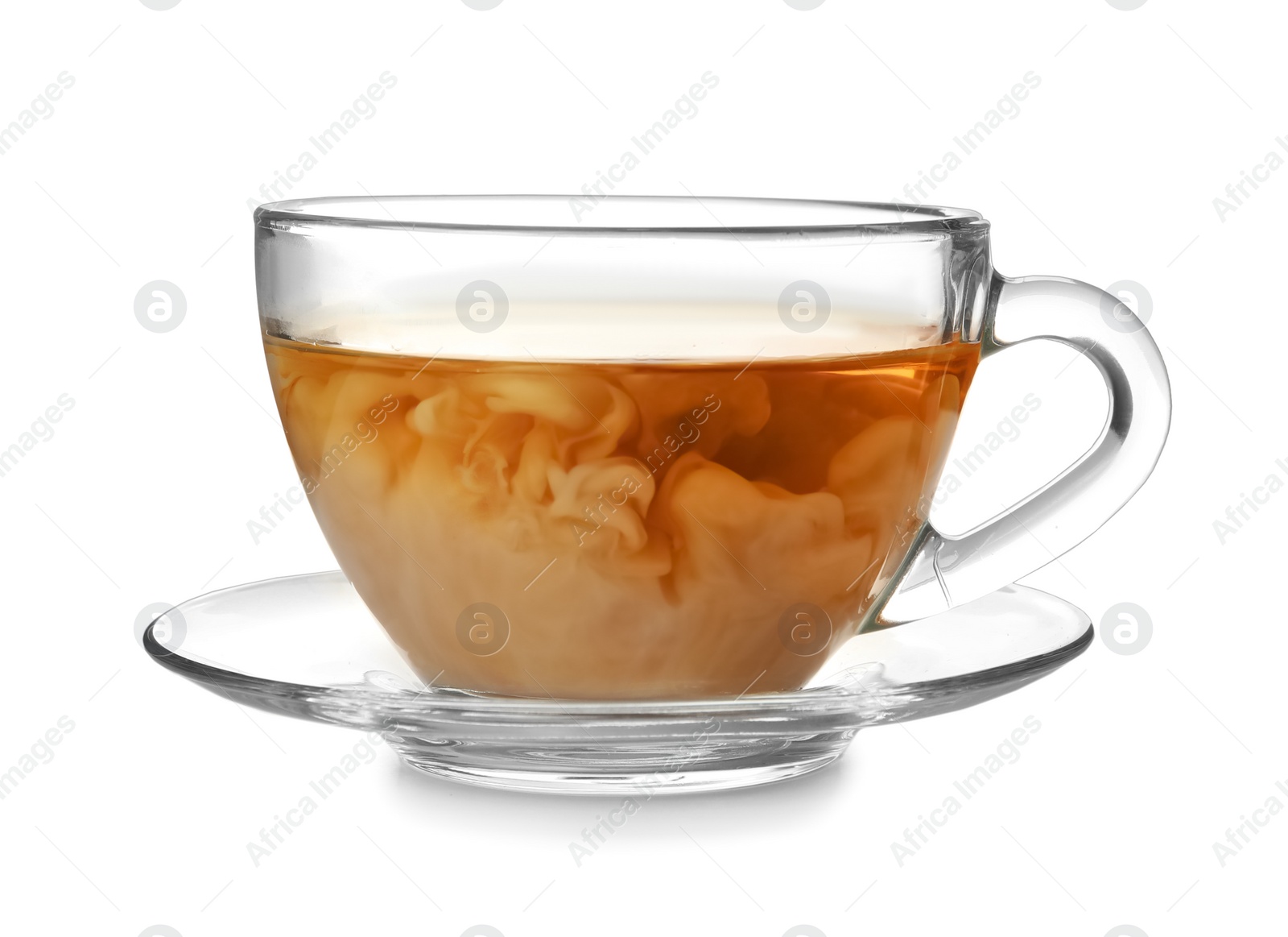 Photo of Glass cup with black tea and milk on white background