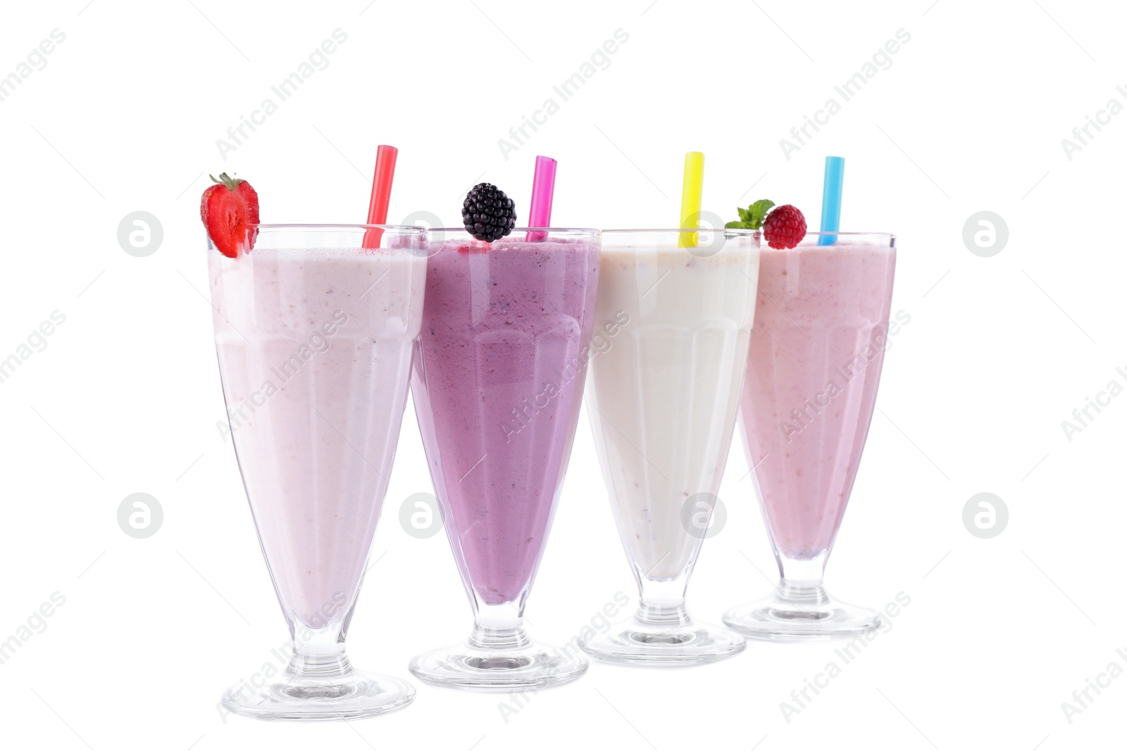 Photo of Different fresh tasty milk shakes in glasses with ingredients on white background