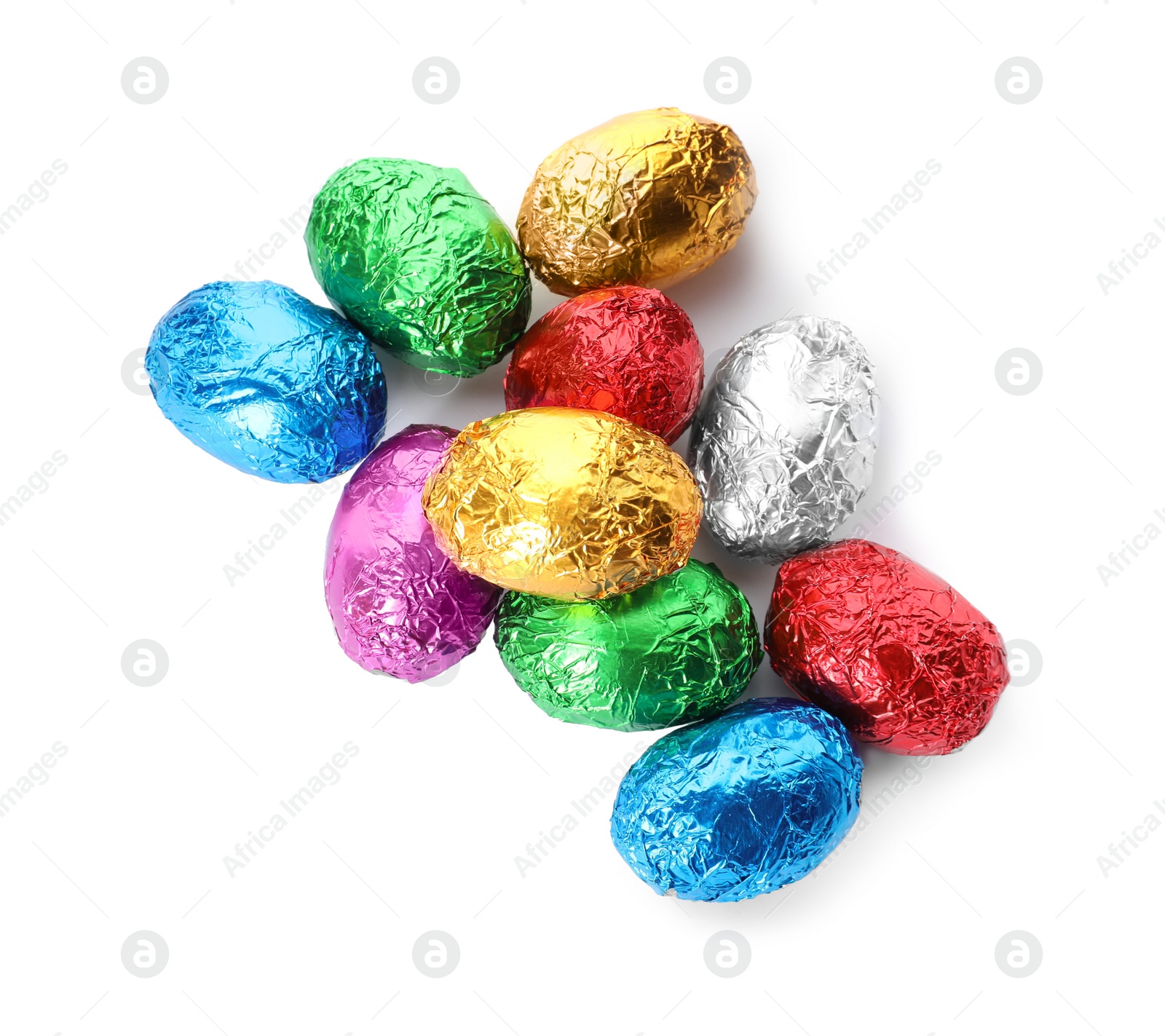 Photo of Chocolate eggs wrapped in colorful foil on white background, top view