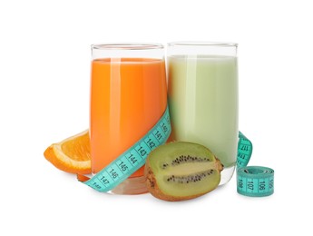 Photo of Tasty shakes, orange, kiwi and measuring tape isolated on white. Weight loss