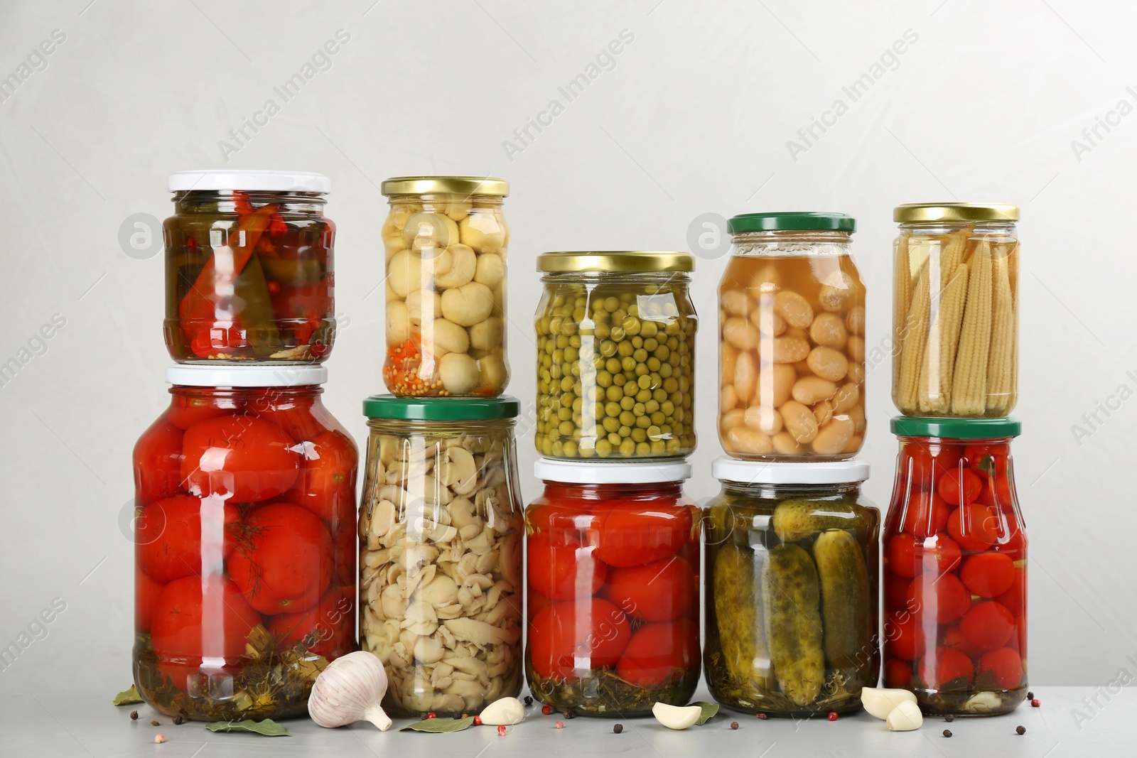 Photo of Jars of pickled vegetables on light table