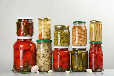 Photo of Jars of pickled vegetables on light table