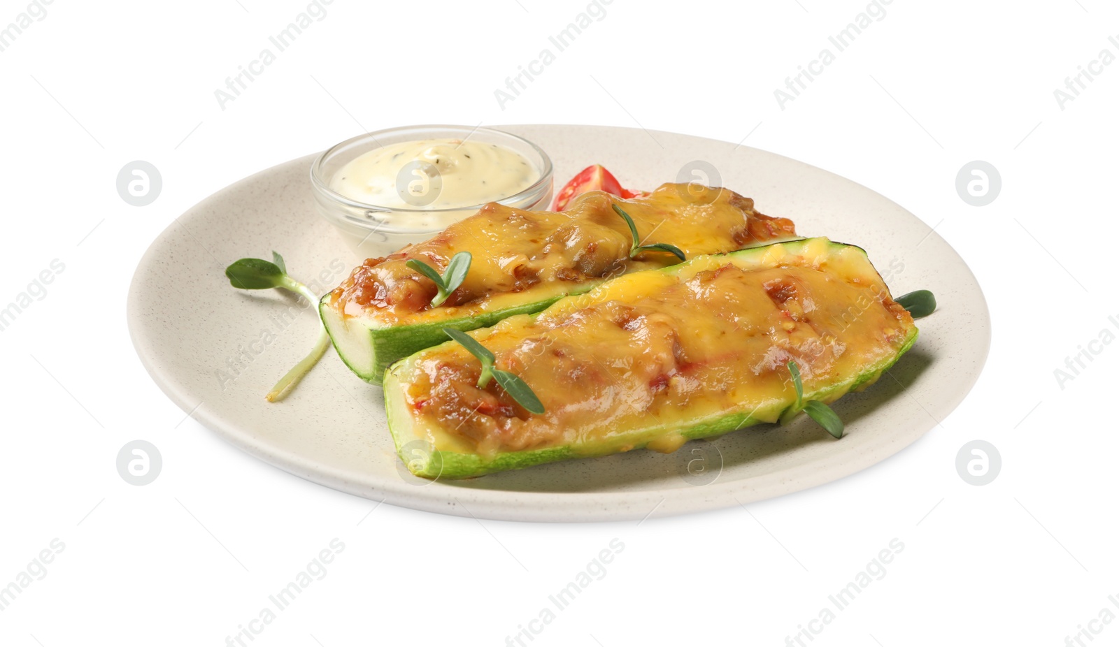 Photo of Baked stuffed zucchinis with sauce on white background