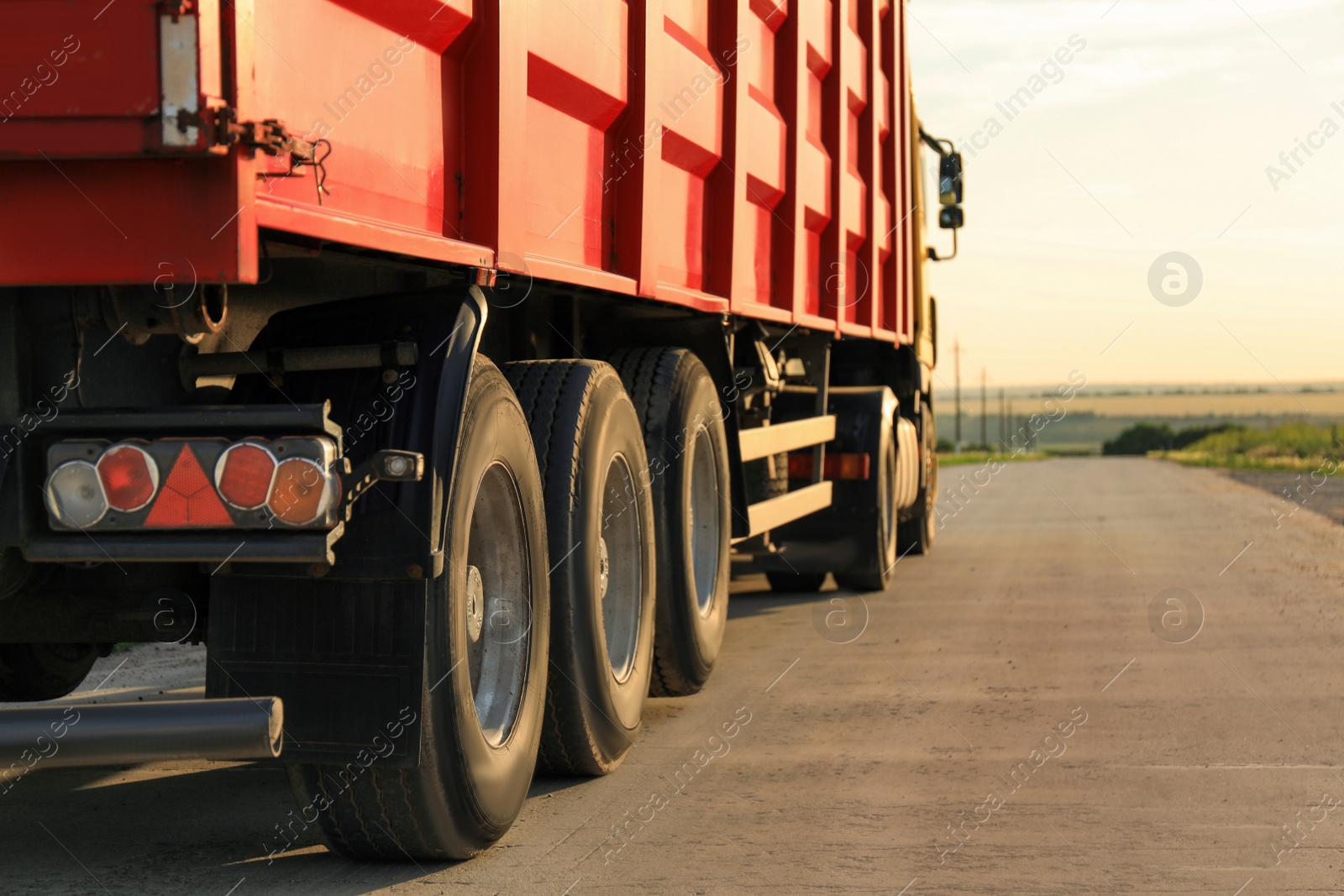 Photo of Modern truck on country road. Space for text