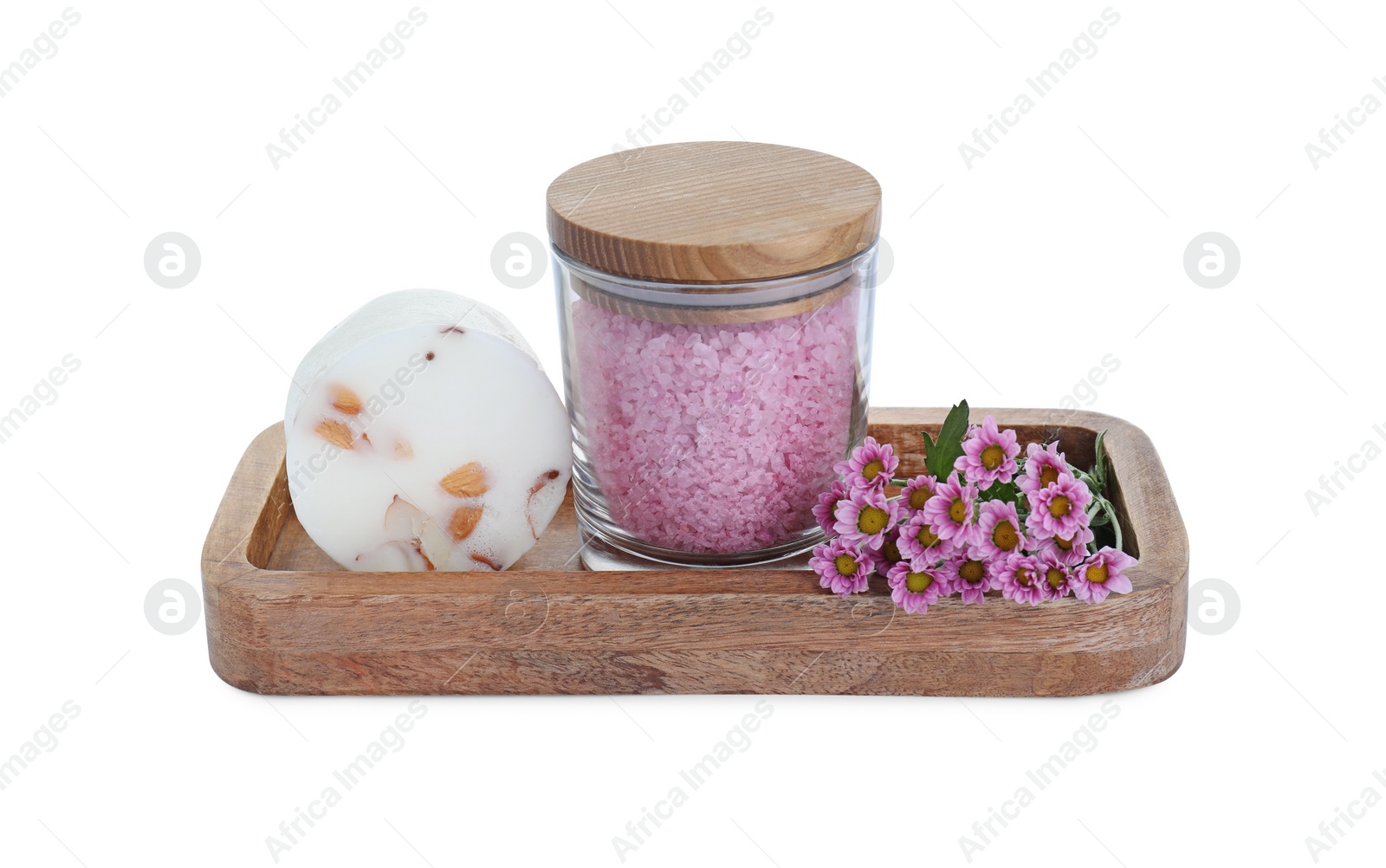 Photo of Glass container of pink sea salt, natural soap and beautiful chrysanthemum flowers isolated on white
