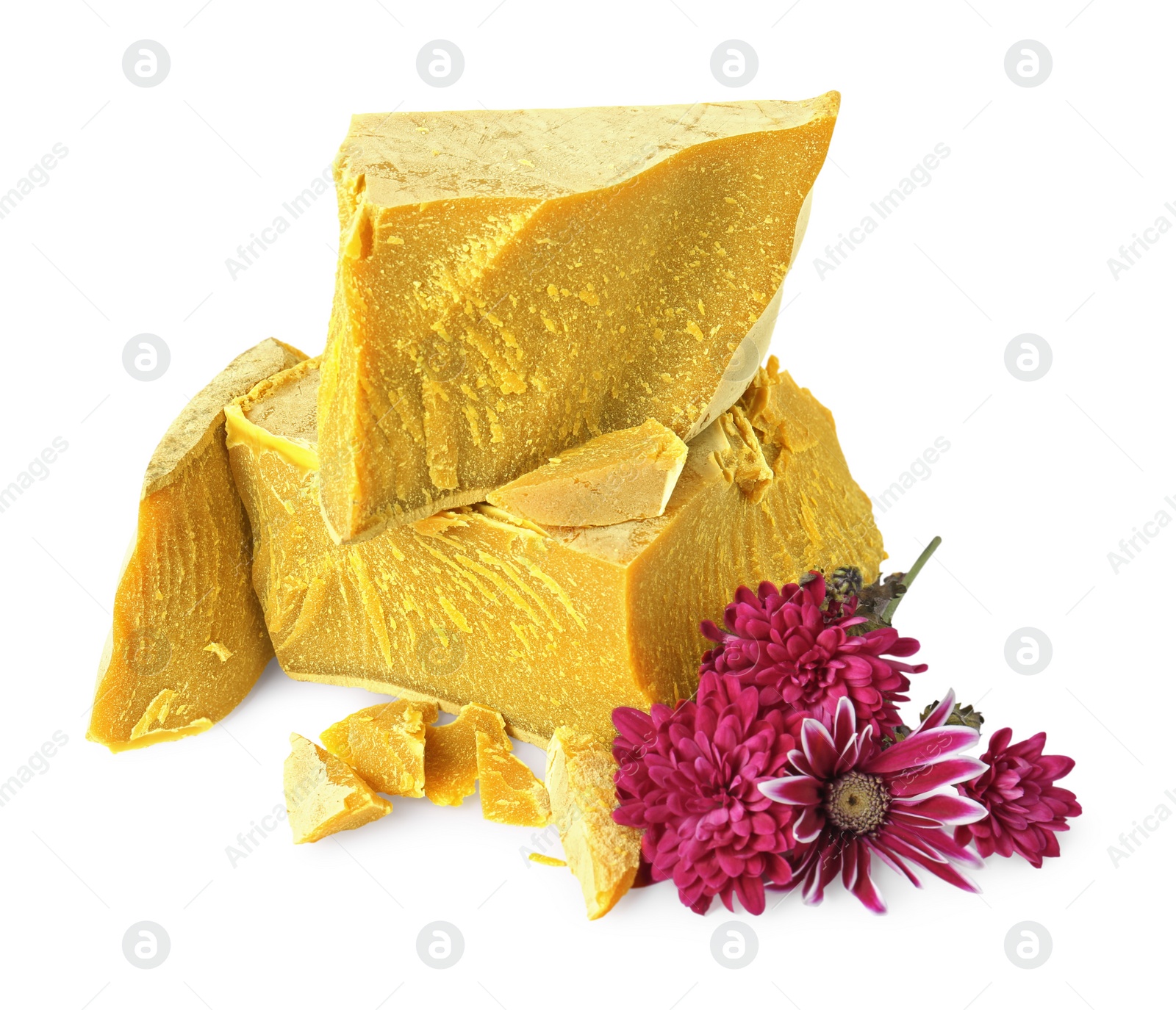 Photo of Natural organic beeswax blocks and flowers on white background