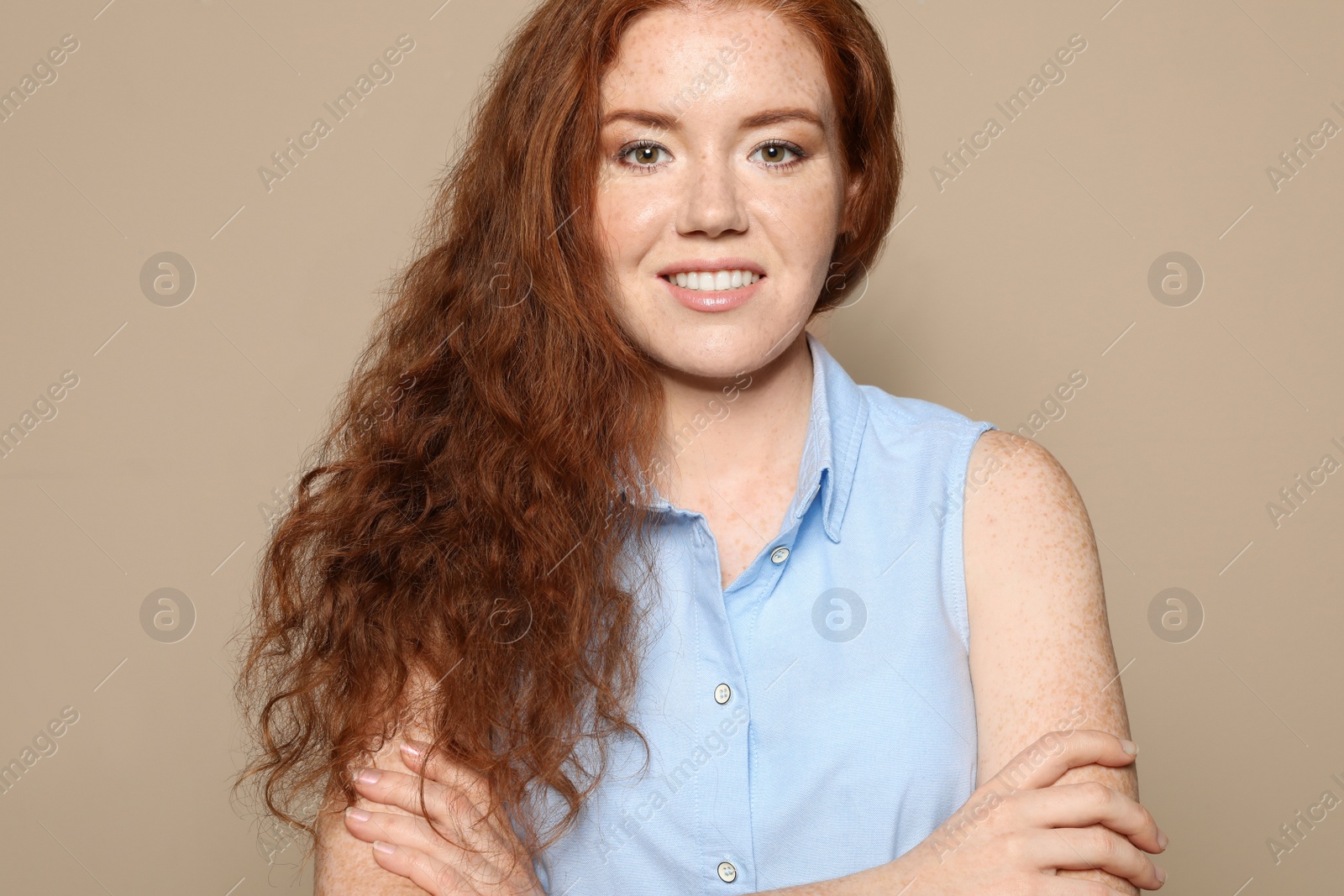 Photo of Portrait of young woman with beautiful face on beige background