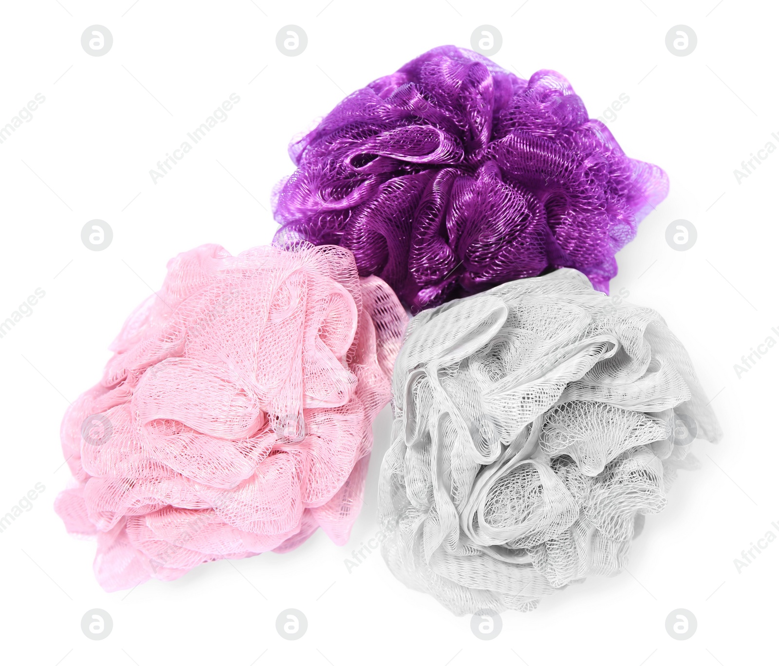 Photo of New shower puffs on white background. Personal hygiene