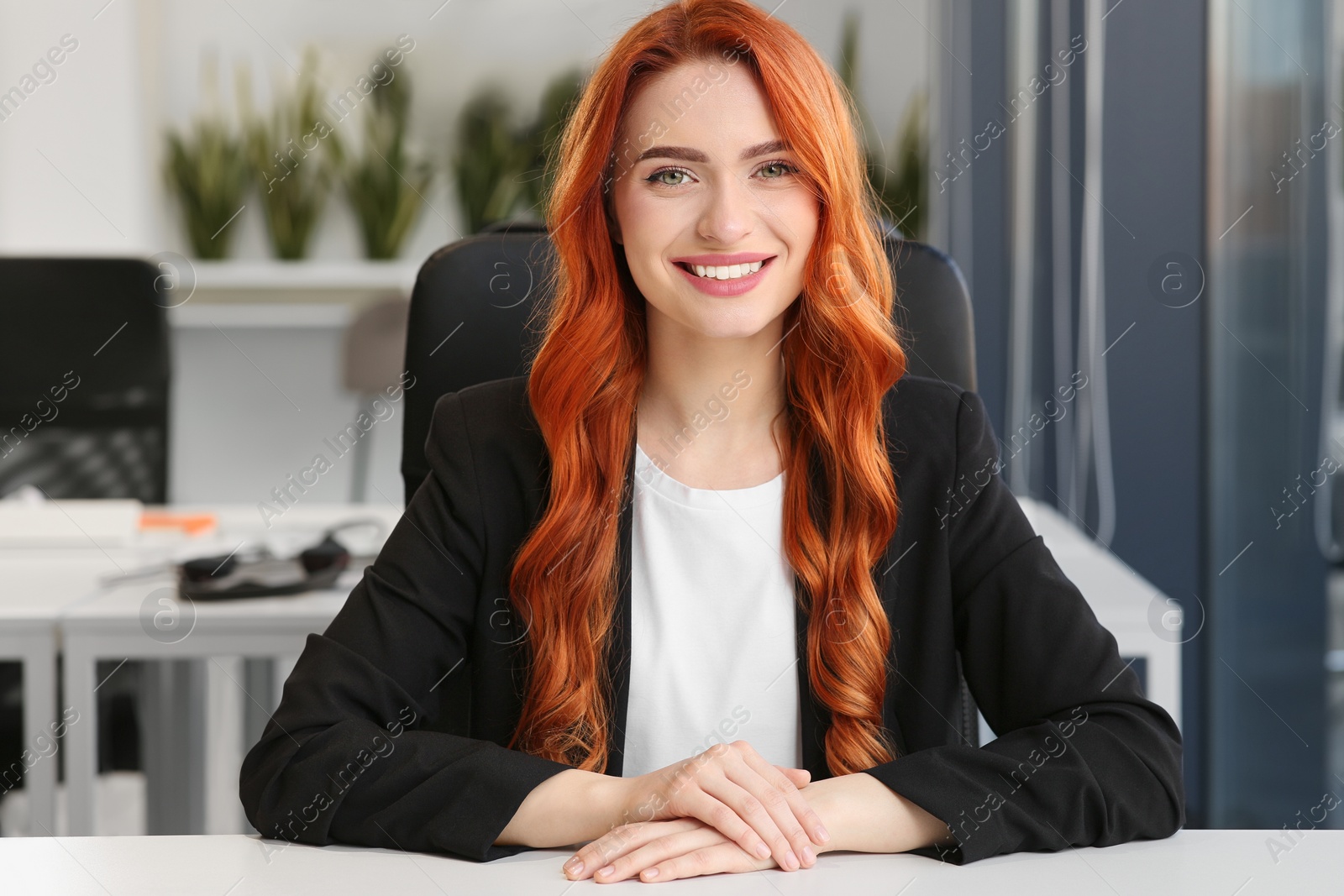 Photo of Happy woman having video call at white desk in office, view from web camera