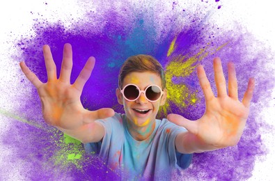 Image of Holi festival celebration. Happy teen boy covered with colorful powder dyes on white background