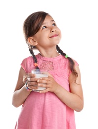 Cute little girl with glass of milk on white background