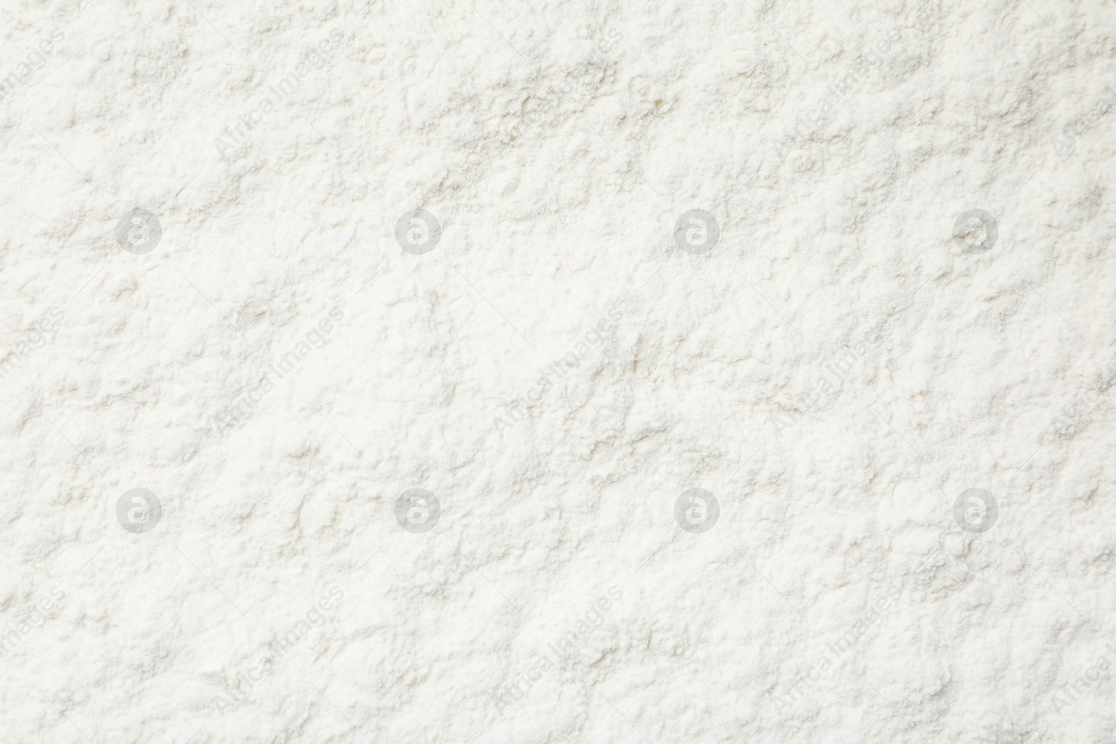 Photo of Pile of organic flour as background, top view