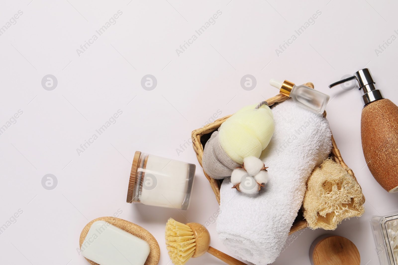 Photo of Bath accessories. Different personal care products and cotton flower on white background, flat lay with space for text