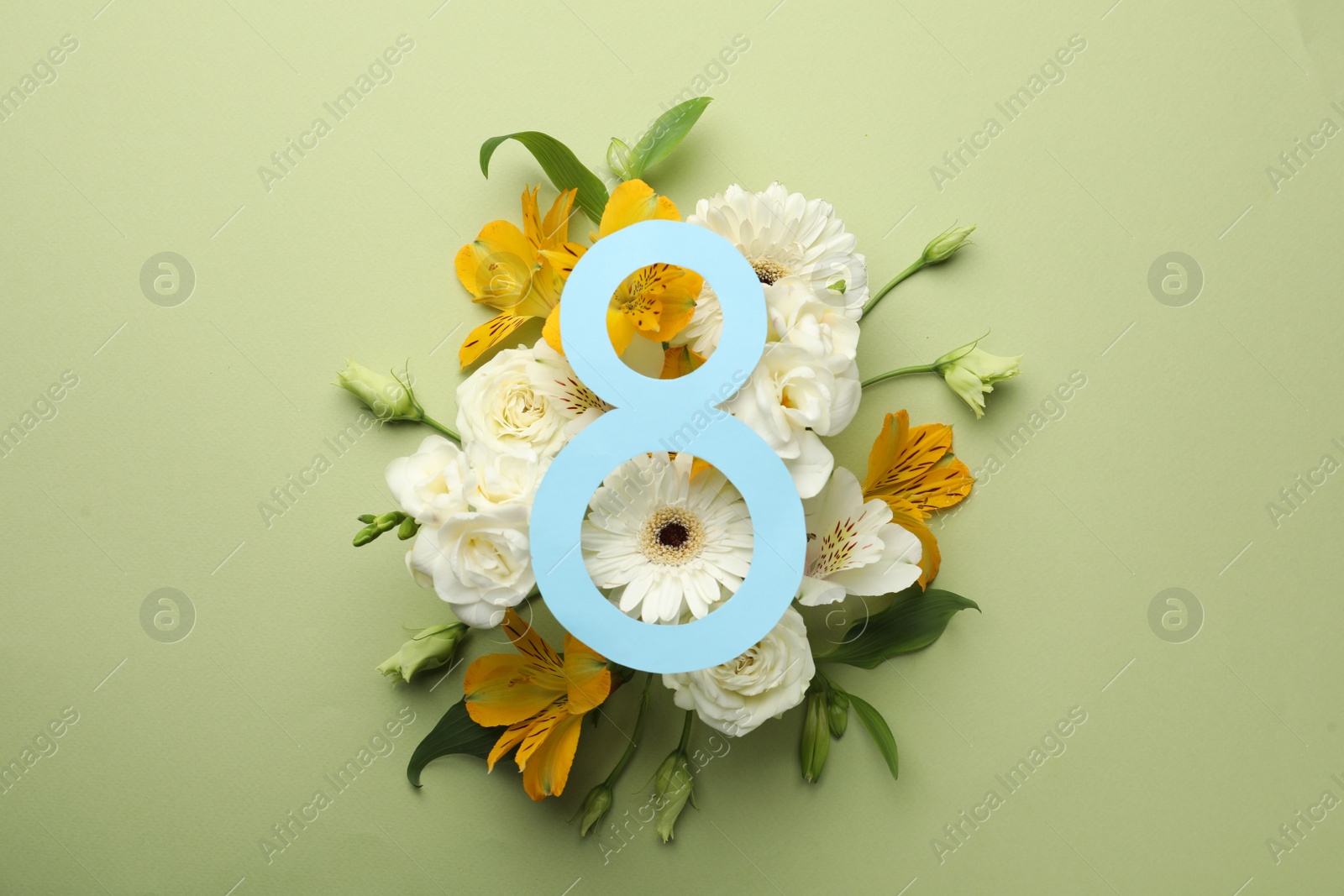 Photo of 8 March greeting card design with beautiful flowers on green background, flat lay. International Women's day