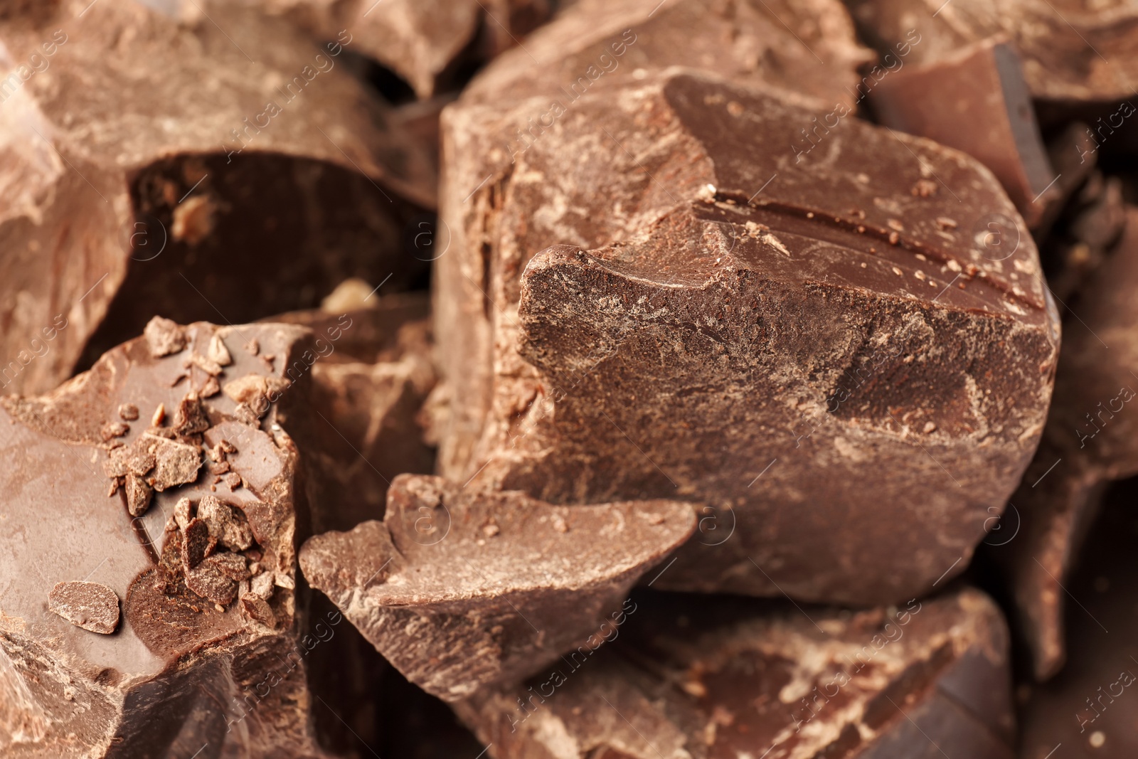 Photo of Delicious black chocolate chunks, closeup