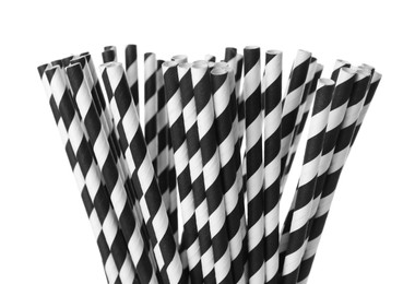 Photo of Striped paper cocktail tubes on white background