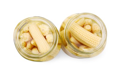 Jars of pickled baby corn isolated on white, top view