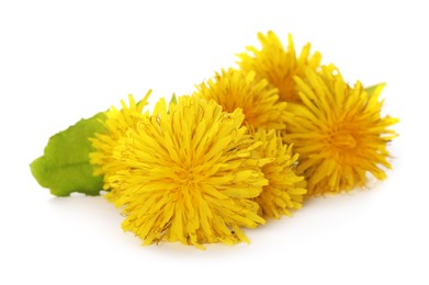 Photo of Beautiful yellow dandelions with leaf on white background