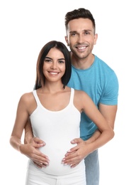 Young happy family holding pregnant belly on white background