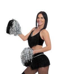 Beautiful cheerleader in costume holding pom poms on white background