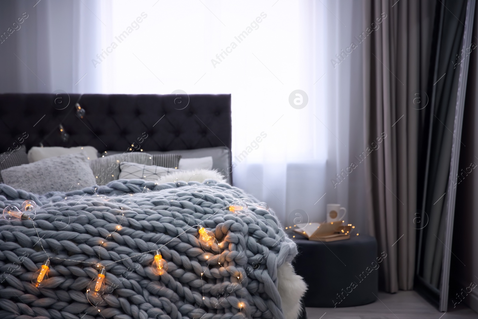 Photo of Cozy room interior with comfortable bed