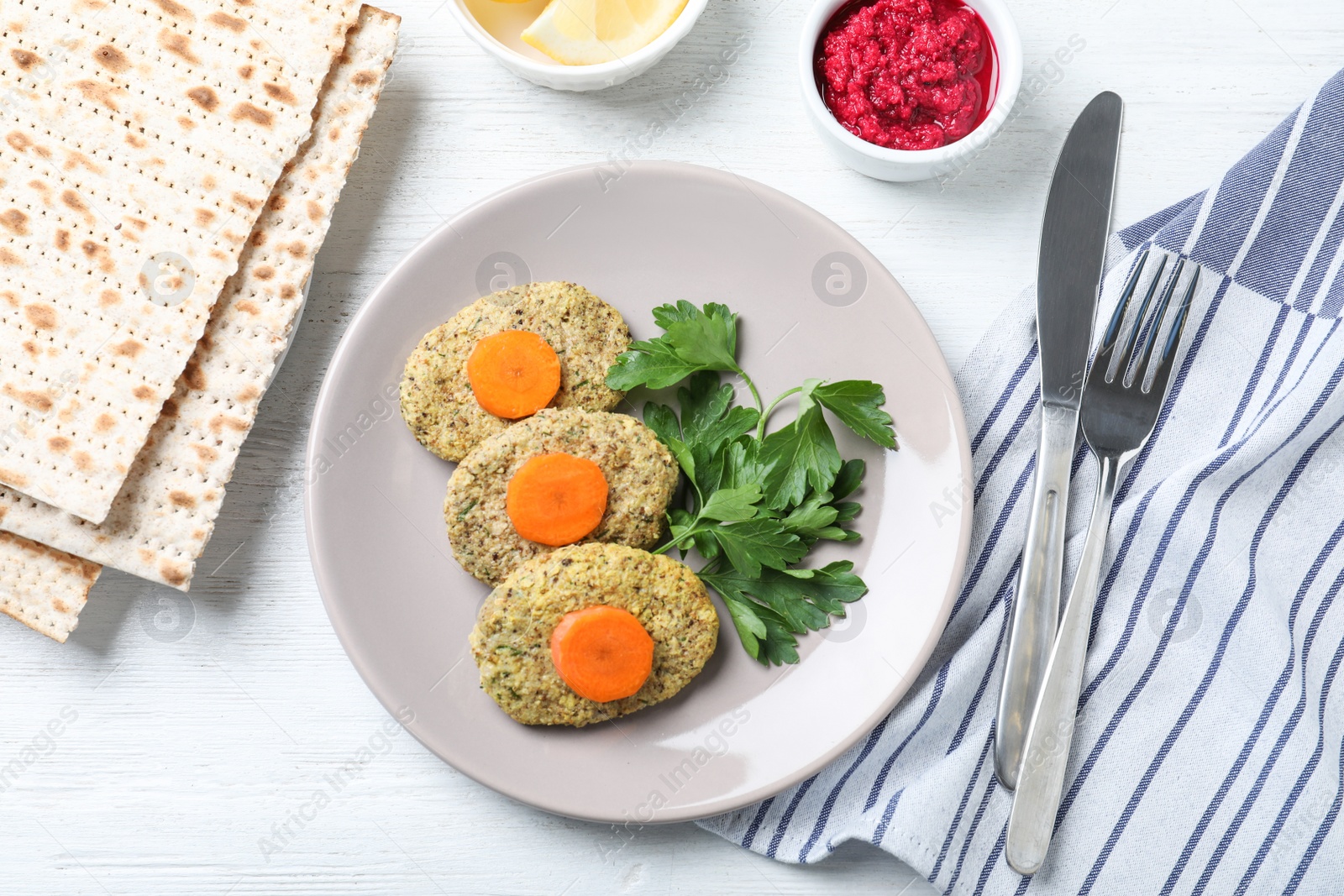 Photo of Flat lay composition with plate of traditional Passover (Pesach) gefilte fish on wooden background